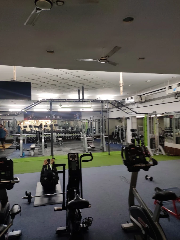 Cardio equipment and open gym floor at Divine Fitness Club